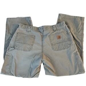 Carhartt 38x30 distressed tan pants, has wear but sturdy pants